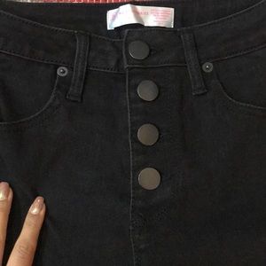 High waisted black button fly skinny jeans